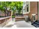 Backyard with AC unit and a pathway leading to a small lawn area at 571 Lockerbie S Cir, Indianapolis, IN 46202