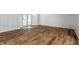 Bright living room with bay windows and wood-look floors at 571 Lockerbie S Cir, Indianapolis, IN 46202