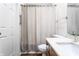 Bathroom with shower, toilet, and wood vanity at 571 Lockerbie S Cir, Indianapolis, IN 46202