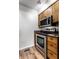 Kitchen features stainless steel stove and microwave at 571 Lockerbie S Cir, Indianapolis, IN 46202