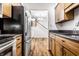 Kitchen with stainless steel appliances and view into dining area at 571 Lockerbie S Cir, Indianapolis, IN 46202