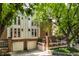Brick townhouse with a two-car garage and landscaping at 571 Lockerbie S Cir, Indianapolis, IN 46202