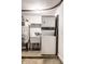 Laundry room with stackable washer and dryer and utility sink at 571 Lockerbie S Cir, Indianapolis, IN 46202
