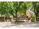 Brick building exterior with a walkway and lush green trees at 571 Lockerbie S Cir, Indianapolis, IN 46202