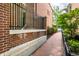 Brick walkway next to a brick wall and small fence at 571 Lockerbie S Cir, Indianapolis, IN 46202