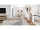 Open living area showcasing a dining space and staircase at 571 Lockerbie S Cir, Indianapolis, IN 46202