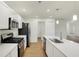 Modern kitchen with stainless steel appliances and an island at 128 Maxim Ct, Cumberland, IN 46229