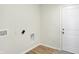 Laundry room with access door and built-in cabinets at 128 Maxim Ct, Cumberland, IN 46229