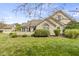 Stone front elevation of charming home with landscaped yard at 16948 Maple Springs Way, Westfield, IN 46074