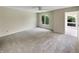 Bedroom with carpet, large window and access to sunroom at 8124 Farmhurst Ln, Indianapolis, IN 46236