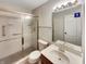 Clean bathroom with a shower/tub combo and updated vanity at 8124 Farmhurst Ln, Indianapolis, IN 46236