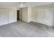 Spacious bedroom with neutral carpeting and double closets at 8124 Farmhurst Ln, Indianapolis, IN 46236