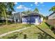 View of backyard with purple house and new landscaping at 324 N Tacoma Ave, Indianapolis, IN 46201