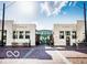 Inviting exterior of The Garage event space, featuring a modern design and spacious outdoor seating at 324 N Tacoma Ave, Indianapolis, IN 46201