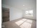 Bedroom with window, carpet, and access to another room at 1129 Mcbride St, Greenfield, IN 46140