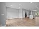 Dining room with hardwood floors and view into kitchen at 7101 Pate Hollow Dr, Brownsburg, IN 46112