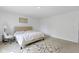 Spacious bedroom with carpeted floor and large window at 10125 Caprock Canyon Dr, Indianapolis, IN 46229