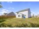 Large backyard with grassy lawn and a partially visible wooden fence at 10125 Caprock Canyon Dr, Indianapolis, IN 46229
