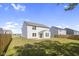 House with a large backyard and a wooden fence at 10125 Caprock Canyon Dr, Indianapolis, IN 46229