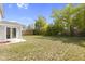 Large backyard with grassy lawn and a partially visible wooden fence at 10125 Caprock Canyon Dr, Indianapolis, IN 46229