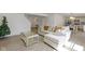 Spacious living room with light beige sectional sofa and large windows at 10125 Caprock Canyon Dr, Indianapolis, IN 46229