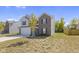 Two story house with gray siding and a brick front at 10125 Caprock Canyon Dr, Indianapolis, IN 46229