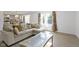 Open living room with sectional sofa and coffee table at 10125 Caprock Canyon Dr, Indianapolis, IN 46229