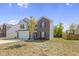 Two story house with gray siding and a brick front at 10125 Caprock Canyon Dr, Indianapolis, IN 46229