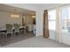 Elegant dining room with chandelier and kitchen view at 10125 Caprock Canyon Dr, Indianapolis, IN 46229