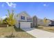Two story house with gray siding and a brick front at 10125 Caprock Canyon Dr, Indianapolis, IN 46229