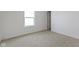 Spacious bedroom featuring a large window and carpet flooring at 10125 Caprock Canyon Dr, Indianapolis, IN 46229