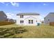Spacious backyard with grassy lawn and a wooden fence at 10125 Caprock Canyon Dr, Indianapolis, IN 46229