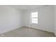 Simple bedroom with large window and closet at 10125 Caprock Canyon Dr, Indianapolis, IN 46229