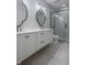 Spa-like bathroom with double vanity, large mirrors, and a walk-in shower at 150 S Main St # 202, Franklin, IN 46131