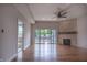 Bright living room featuring hardwood floors, fireplace, and sliding glass doors at 150 S Main St # 202, Franklin, IN 46131