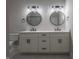 Elegant bathroom boasting double vanity, frameless shower, and modern fixtures at 150 S Main St # 202, Franklin, IN 46131