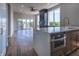 Modern kitchen with island, stainless steel appliances, and dark cabinetry at 150 S Main St # 202, Franklin, IN 46131