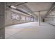 Underground parking garage with concrete floors and designated parking spaces at 150 S Main St # 202, Franklin, IN 46131