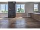 Living room with fireplace, hardwood floors, and kitchen access at 150 S Main St # 202, Franklin, IN 46131