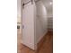 Walk-in pantry with sliding barn door and custom shelving at 150 S Main St # 302, Franklin, IN 46131