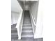 Gray carpeted staircase leading to the upper level at 6558 Caressa Way, Indianapolis, IN 46259