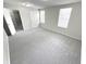 Bright bedroom featuring gray carpeting and two windows at 6558 Caressa Way, Indianapolis, IN 46259