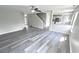 Spacious living room with grey vinyl flooring and kitchen view at 6558 Caressa Way, Indianapolis, IN 46259