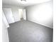 Bright bedroom with gray carpeting and an adjacent closet at 6558 Caressa Way, Indianapolis, IN 46259