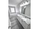 Bathroom with double vanity, granite countertop and bathtub at 6558 Caressa Way, Indianapolis, IN 46259