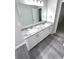Bathroom with double vanity and granite countertop at 6558 Caressa Way, Indianapolis, IN 46259