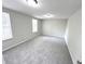 Well lit bedroom with gray carpet and two windows at 6558 Caressa Way, Indianapolis, IN 46259