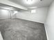 Large finished basement offering plenty of space with gray carpeting at 6558 Caressa Way, Indianapolis, IN 46259