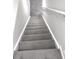 Gray carpeted stairs leading to the upper level of the home at 6558 Caressa Way, Indianapolis, IN 46259