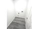 Bright laundry room with vinyl flooring and space for washer and dryer at 6558 Caressa Way, Indianapolis, IN 46259